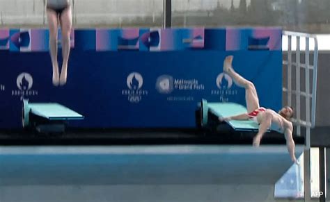 French diver Alexis Jandard slips during Olympic inauguration .
